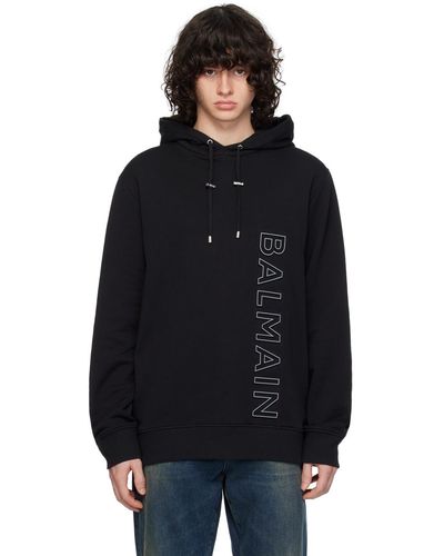 Balmain Pull à capuche noir à logo gaufré