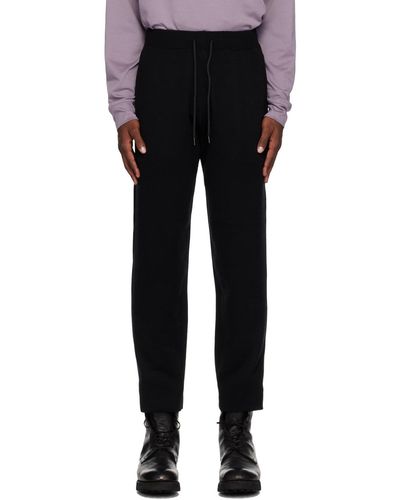 Attachment Pantalon de survêtement noir en tricot double face
