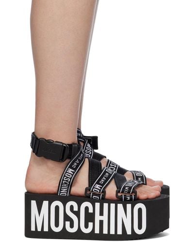 Moschino Sandales noires à plateforme et à logos