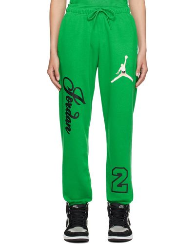 Nike Pantalon de détente vert à logos et textes