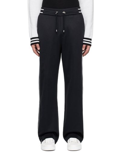 Balmain Pantalon de survêtement bleu marine et blanc à écusson à logo - Noir