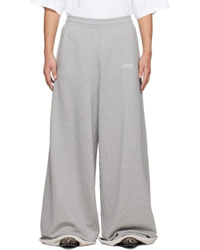 Vetements Pantalon de survêtement gris à logos brodés - Blanc
