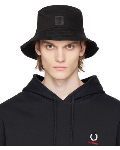 Raf Simons Chapeau bob noir à écusson à logo