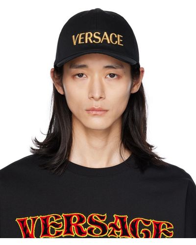 Versace Casquette noire à logos brodés