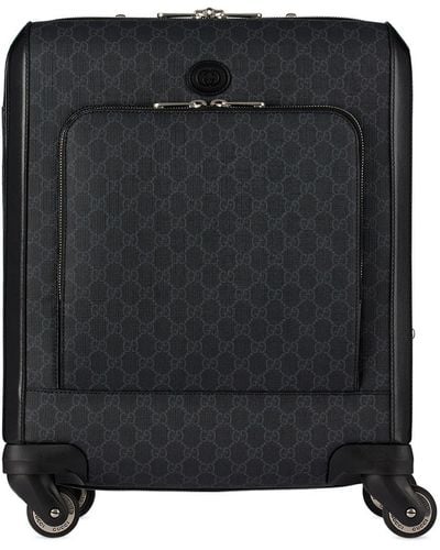 Gucci Petite valise noire à logos gg