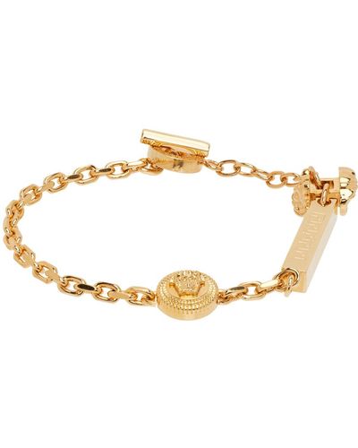 Versace Bracelet doré et argenté à motif à clé grecque et à méduses - Métallisé