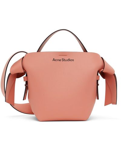 Acne Studios Mini sac à bandoulière rose à nœuds musubi