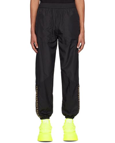 Versace Pantalon de détente noir à motif à clé grecque