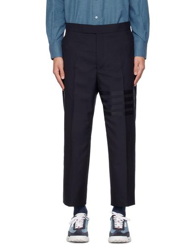 Thom Browne Thom e pantalon bleu marine à quatre rayures et à patte