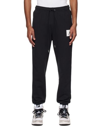 Nike Pantalon de détente flight noir