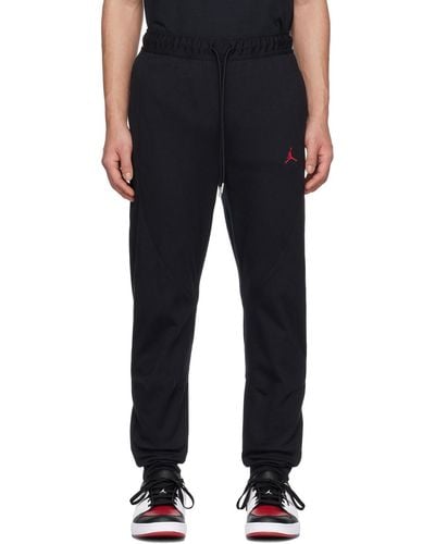 Nike Pantalon de survêtement essentials warm up noir