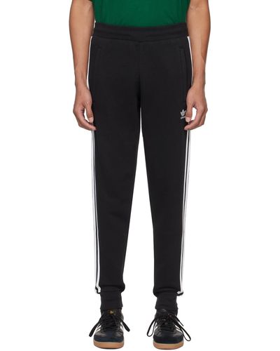 adidas Originals Pantalon de survêtement adicolor classics noir en coton à rayures