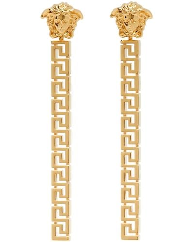Versace Boucles d'oreilles pendantes dorées à méduse et à motif à clé grecque - Multicolore