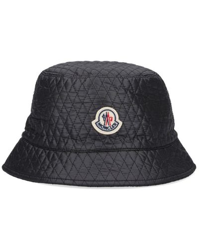 Moncler Cappello nero bucket trapuntato con logo