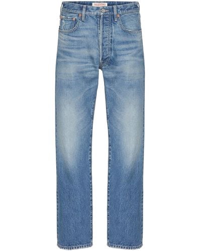 Valentino Garavani Denim Trousers With Metallic V Detail - Blue