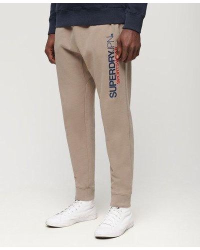 Superdry Taps Toelopende joggingbroek Met Sportswear-logo - Naturel