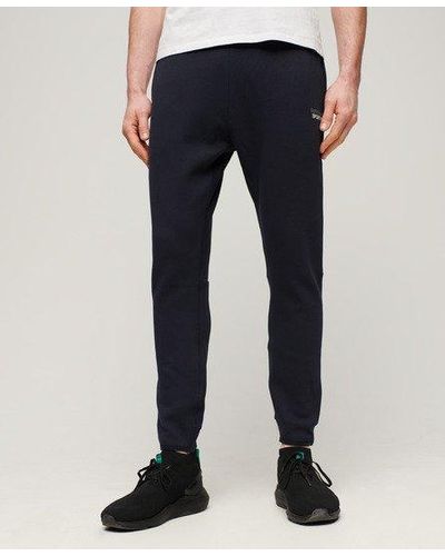 Superdry Pantalon de survêtement fuselé à logo sport tech - Bleu