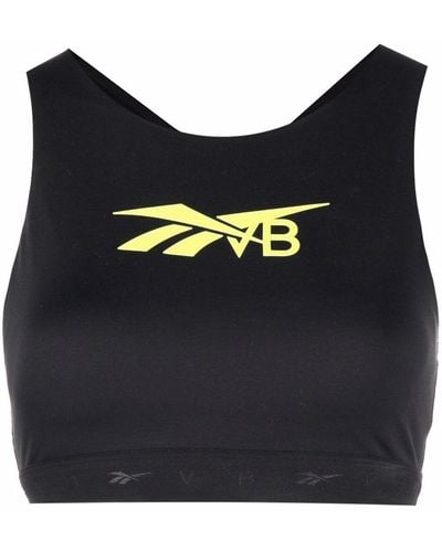 Crossover-back logo sports bra in green - Reebok X Victoria