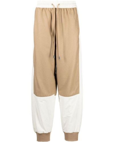 JW Anderson Colour-block Tapered Track Pants - Natural