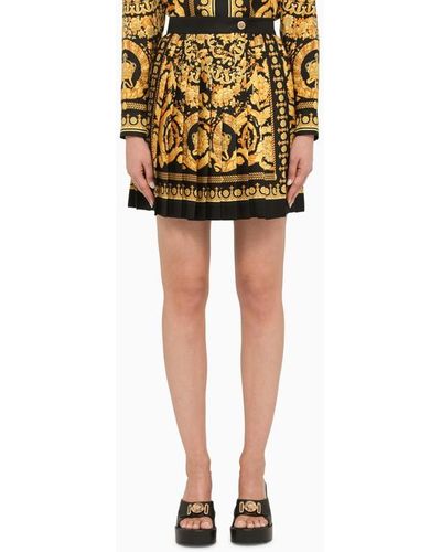 Versace Minigonna nera e oro plissettata in seta - Giallo