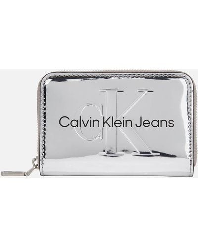 Calvin Klein Logo-embossed Metallic Purse - Natural