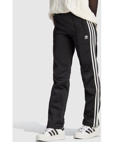 Adidas originals bellista three stripe cuffed joggers in online black