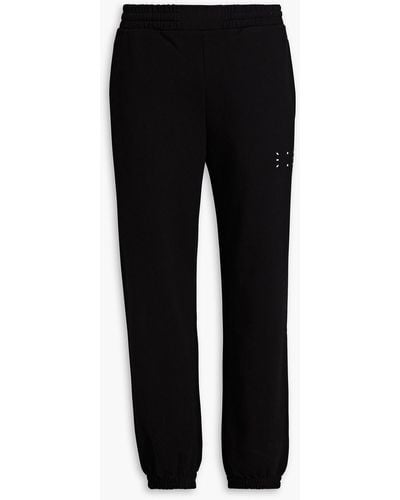 McQ Appliquéd French Cotton-terry Sweatpants - Black