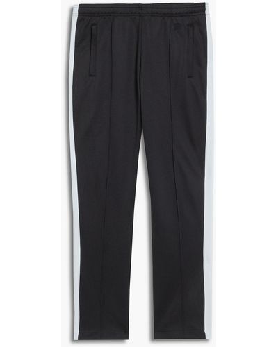 Sandro Two-tone Knitted-trimmed Cotton-blend Track Pants - Black