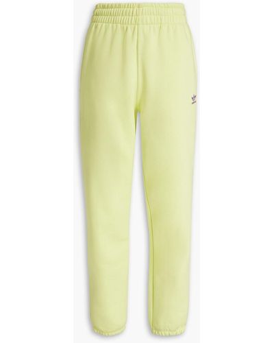 adidas Originals Track pants aus fleece aus einer baumwollmischung - Gelb