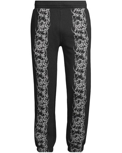 Givenchy Pantaloni in cotone stampato - Nero