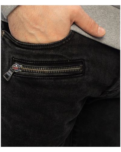 Balmain Schlanke Jeans mit konisch zulaufendem Bein - Schwarz