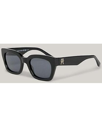 Tommy Hilfiger Cat-Eye-Sonnenbrille mit TH-Monogramm - Schwarz