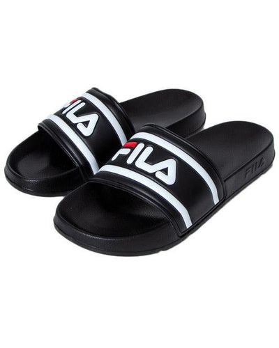Fila Flats and flat shoes for Women | Online Sale up to 55% off | Lyst