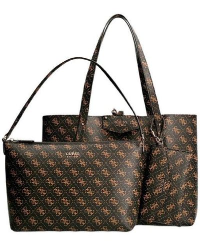 Guess Tote Bag Price: $790.00 Spacious enough to meet your everyday needs,  this tote features a one-compartment design. Free delivery…