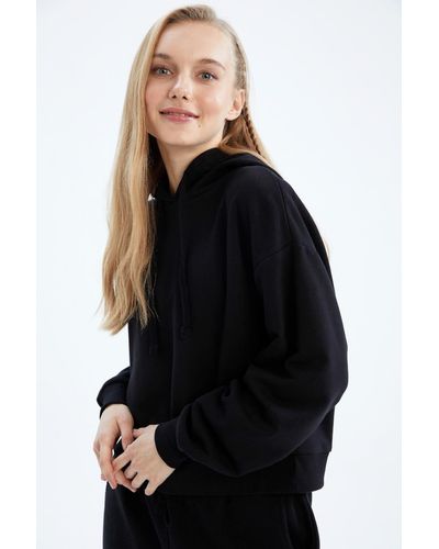 Defacto Cooles sweatshirt mit lockerer passform und kapuze - Schwarz