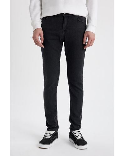 Defacto Super skinny fit slim fit jeanshose mit normaler taille und extra schmalem bein - Schwarz
