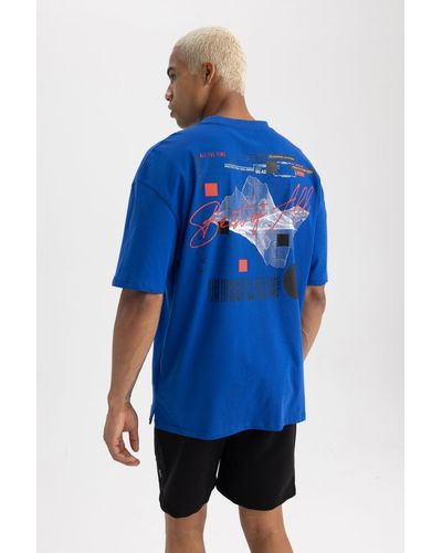 Defacto Passform: oversize-passform, rundhalsausschnitt, bedrucktes kurzarm-t-shirt a7055ax23hs - Blau