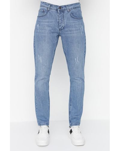 Trendyol Hellblaue slim-fit-jeans aus stretchstoff mit destroyed-effekten und denim-hose