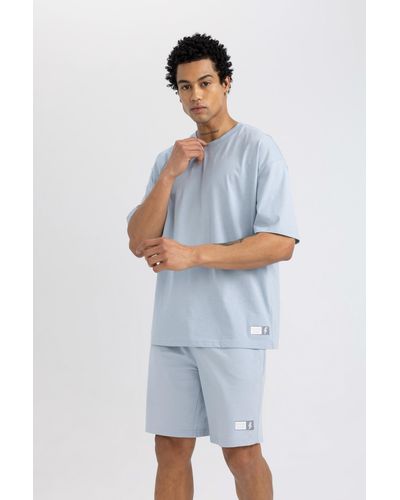 Defacto Fit t-shirt mit rundhalsausschnitt und aufdruck in übergröße - Blau