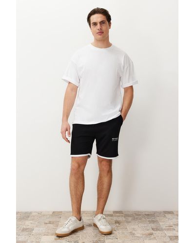 Trendyol E shorts mit normaler/normaler schnittform und buchstaben-aufdruck und gummibund - Schwarz