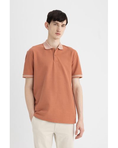 Defacto Neues polo-t-shirt mit normaler passform und kurzen ärmeln - Orange