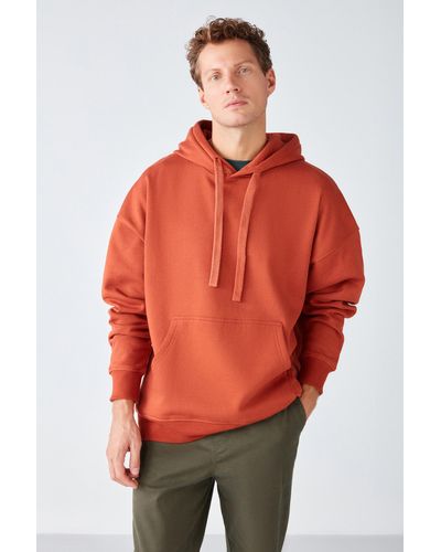 Grimelange Steve sweatshirt aus weichem stoff mit kapuze und kordelzug, oversize-passform, ziegelfarben - Orange