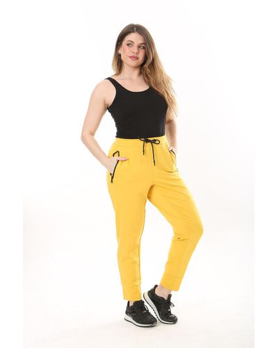 Şans Şans e sporthose mit ösenspitze und elastischem reißverschluss sowie taschendetail in übergröße - Gelb