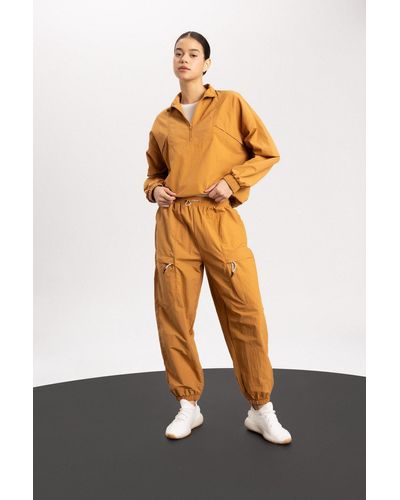 Defacto Fit jogginghose mit lockerer passform und zwei taschen, jogger-bein, standardgröße, - Orange