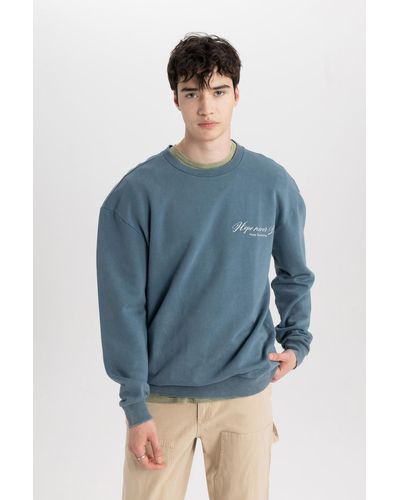 Defacto Comfort fit-sweatshirt mit rundhalsausschnitt und rückendruck c1665ax24sp - Blau