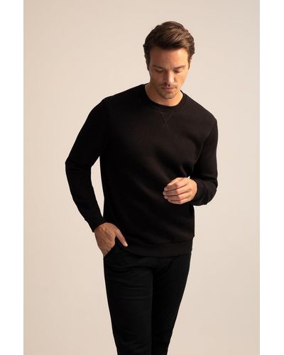 Defacto Basic-sweatshirt aus baumwolle mit normaler passform und rundhalsausschnitt - Schwarz
