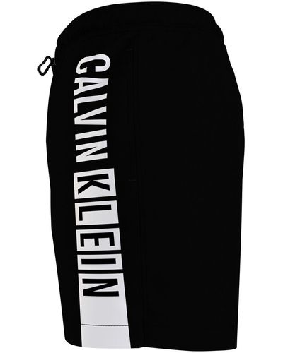 Calvin Klein Schnelltrocknende shorts aus em polyester mit markenlogo , geeignet für den einsatz am strand und am meer km0km00 - Schwarz