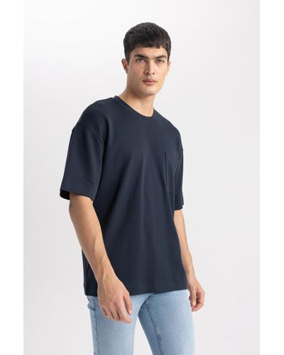 Defacto Kurzarm-t-shirt aus 100 % schwerer baumwolle mit rundhalsausschnitt und oversize-passform t3661az24sp - Blau