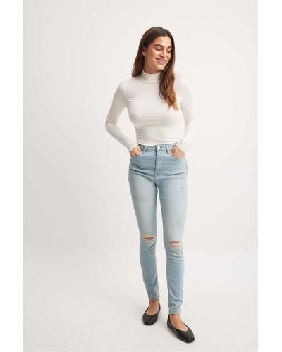NA-KD Skinny jeans mit destroyed-effekt und hoher taille aus bio-baumwolle - Blau