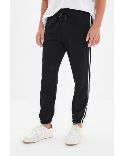 Trendyol E, gestreifte, elastische jogginghose mit normaler passform - Schwarz